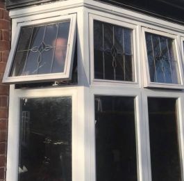 Purpose made softwood window casements with leaded lights encapsulated in double glazing: Click Here To View Larger Image