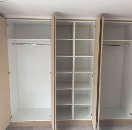 Wardrobes - units manufactured from white Melamine Faced MDF with shelving and hanging rail: Click Here To View Larger Image