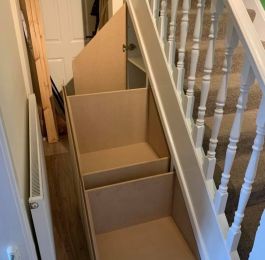 Purpose made understairs storage units with white melamine faced MDF units and MDF drawers, doors: Click Here To View Larger Image