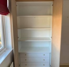 Purpose made wardrobe, Unit, shelves and drawers manufactured from white melamine MDF.  Drawers on soft close drawer runners.  Plain MDF doors hung on soft close hinges: Click Here To View Larger Image