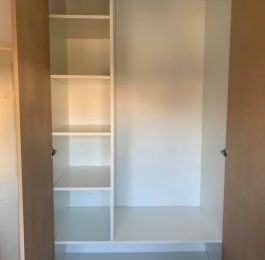 Purpose made wadrobes, units and shelve manufactured from white melamine MDF, doors from plain MDF hung on soft close hinges : Click Here To View Larger Image