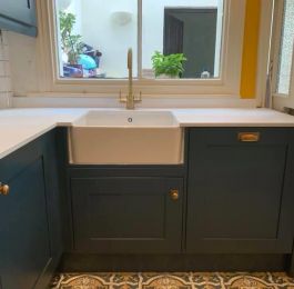 Ceramic Belfast sink which has been fitted into units with Midnight Blue Solid wood hand painted doors and a solid granite worktop and splashbacks: Click Here To View Larger Image